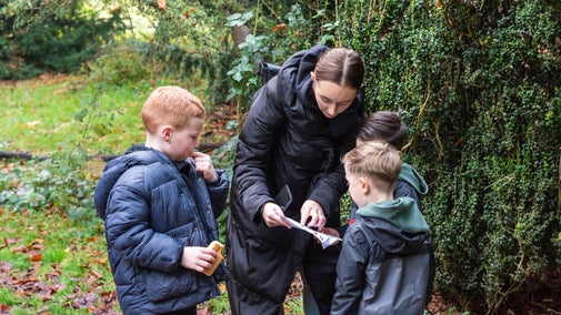 Families exploring the gardens and and the wider landscape at Calke Abbey, Derbyshire